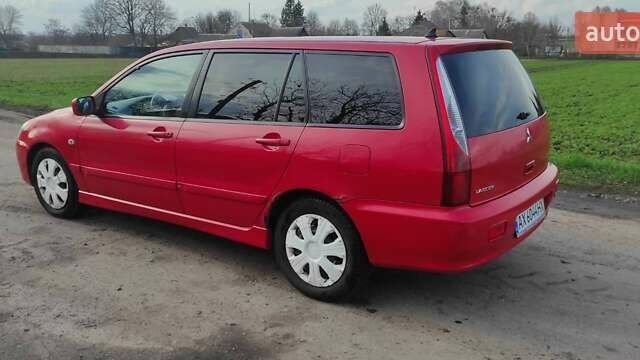 Красный Мицубиси Лансер, объемом двигателя 2 л и пробегом 200 тыс. км за 4500 $, фото 3 на Automoto.ua