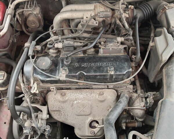 Красный Мицубиси Лансер, объемом двигателя 1.6 л и пробегом 217 тыс. км за 3750 $, фото 6 на Automoto.ua