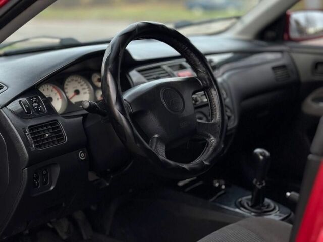 Красный Мицубиси Лансер, объемом двигателя 1.6 л и пробегом 290 тыс. км за 2800 $, фото 4 на Automoto.ua