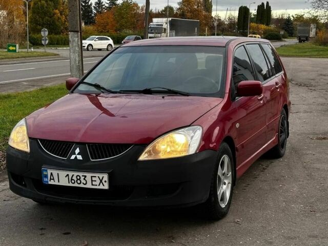 Красный Мицубиси Лансер, объемом двигателя 1.6 л и пробегом 290 тыс. км за 2800 $, фото 1 на Automoto.ua