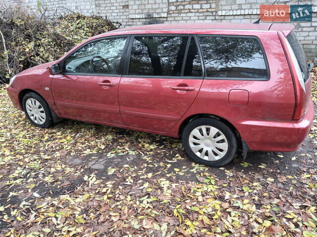 Красный Мицубиси Лансер, объемом двигателя 1.6 л и пробегом 217 тыс. км за 3750 $, фото 1 на Automoto.ua