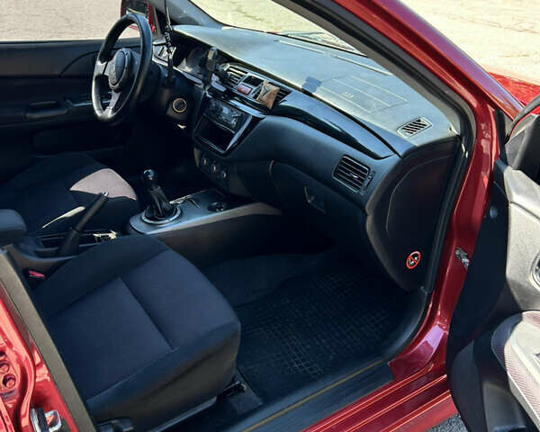 Червоний Міцубісі Lancer, об'ємом двигуна 1.6 л та пробігом 244 тис. км за 3900 $, фото 11 на Automoto.ua