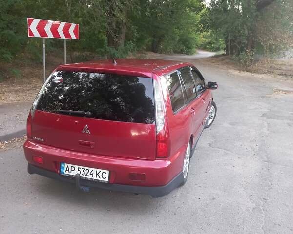 Красный Мицубиси Лансер, объемом двигателя 1.6 л и пробегом 280 тыс. км за 4000 $, фото 16 на Automoto.ua