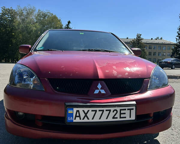 Червоний Міцубісі Lancer, об'ємом двигуна 1.6 л та пробігом 244 тис. км за 3900 $, фото 17 на Automoto.ua