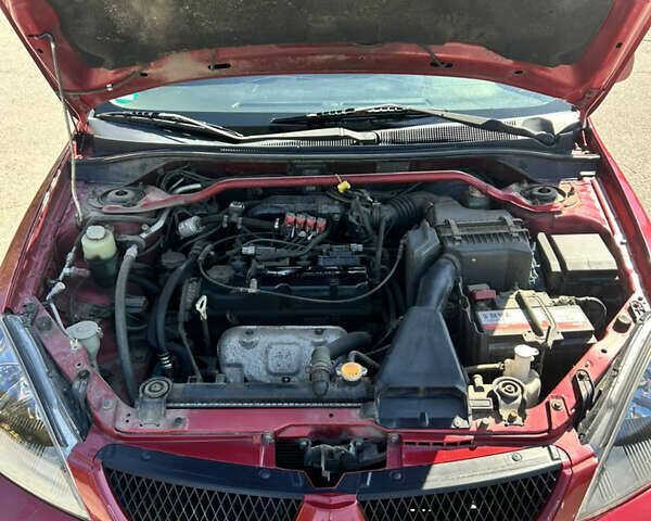 Червоний Міцубісі Lancer, об'ємом двигуна 1.6 л та пробігом 244 тис. км за 3900 $, фото 22 на Automoto.ua