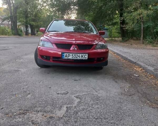 Красный Мицубиси Лансер, объемом двигателя 1.6 л и пробегом 280 тыс. км за 4000 $, фото 1 на Automoto.ua