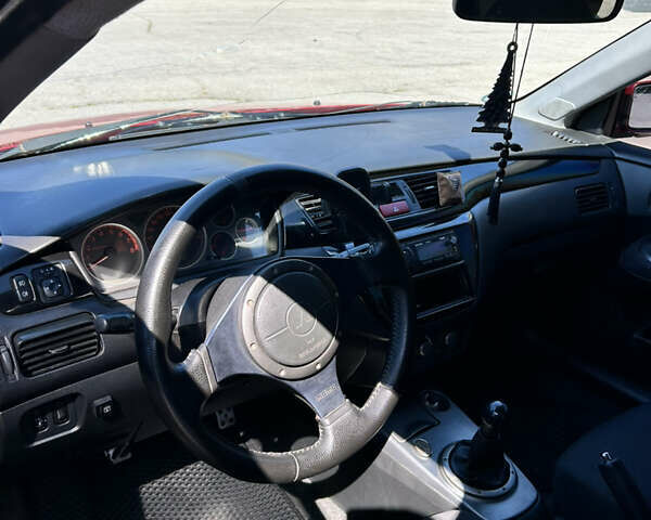 Червоний Міцубісі Lancer, об'ємом двигуна 1.6 л та пробігом 244 тис. км за 3900 $, фото 7 на Automoto.ua