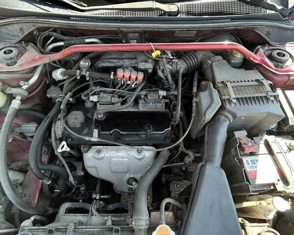 Червоний Міцубісі Lancer, об'ємом двигуна 1.6 л та пробігом 244 тис. км за 3900 $, фото 23 на Automoto.ua