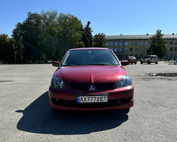 Червоний Міцубісі Lancer, об'ємом двигуна 1.6 л та пробігом 244 тис. км за 3900 $, фото 2 на Automoto.ua