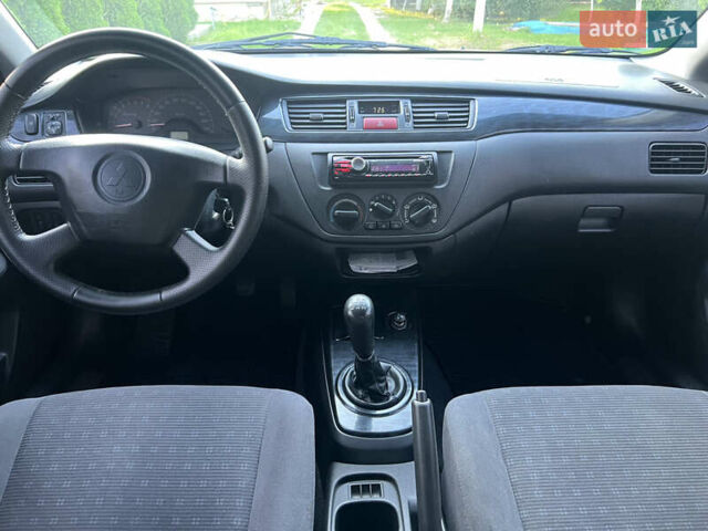 Мицубиси Лансер, объемом двигателя 1.6 л и пробегом 292 тыс. км за 4300 $, фото 11 на Automoto.ua