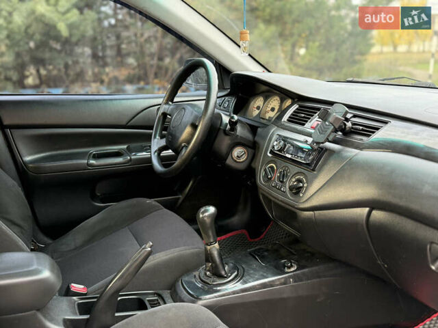 Мицубиси Лансер, объемом двигателя 1.6 л и пробегом 230 тыс. км за 3700 $, фото 6 на Automoto.ua