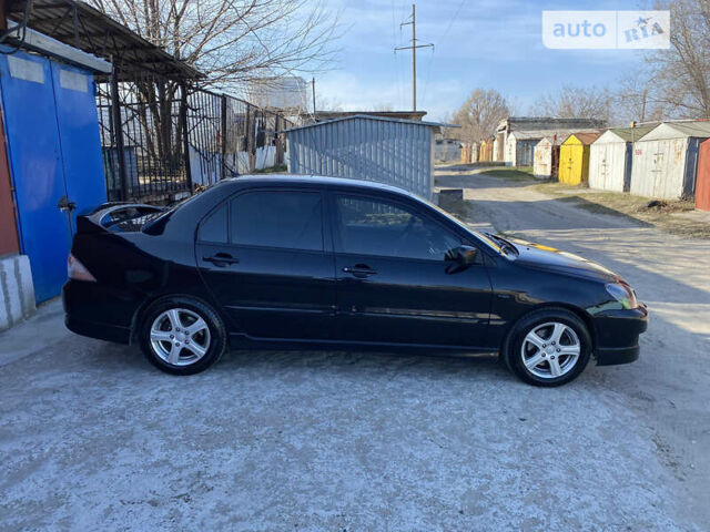 Міцубісі Lancer, об'ємом двигуна 2 л та пробігом 180 тис. км за 5999 $, фото 26 на Automoto.ua