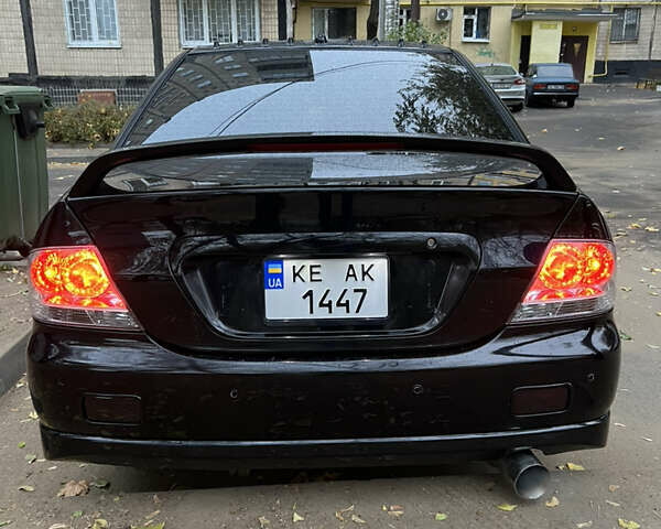 Мицубиси Лансер, объемом двигателя 2 л и пробегом 299 тыс. км за 4950 $, фото 2 на Automoto.ua