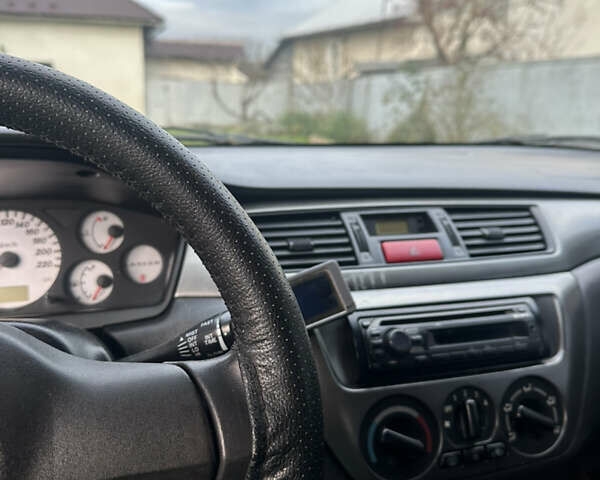 Мицубиси Лансер, объемом двигателя 1.58 л и пробегом 288 тыс. км за 3700 $, фото 7 на Automoto.ua