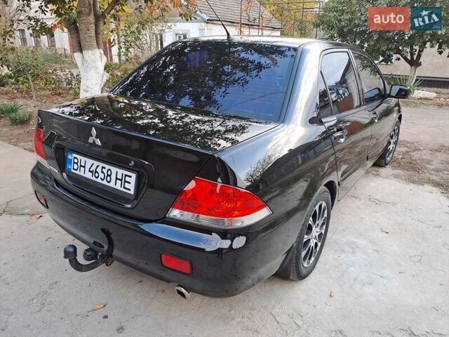 Мицубиси Лансер, объемом двигателя 1.6 л и пробегом 170 тыс. км за 6000 $, фото 26 на Automoto.ua