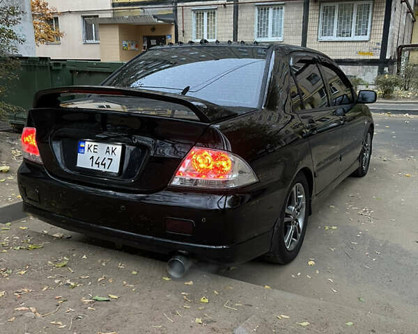 Мицубиси Лансер, объемом двигателя 2 л и пробегом 299 тыс. км за 4950 $, фото 5 на Automoto.ua