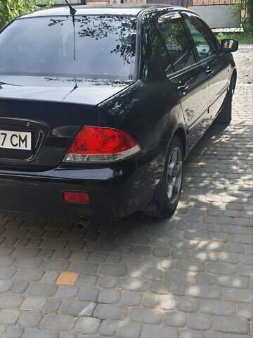 Мицубиси Лансер, объемом двигателя 1.58 л и пробегом 220 тыс. км за 4200 $, фото 6 на Automoto.ua