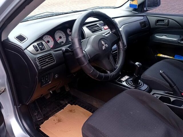 Мицубиси Лансер, объемом двигателя 1.6 л и пробегом 230 тыс. км за 3800 $, фото 7 на Automoto.ua