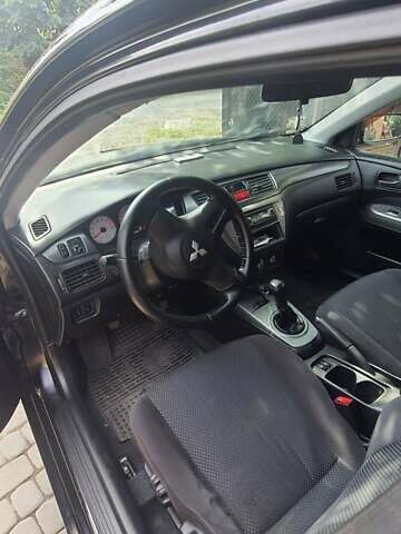 Мицубиси Лансер, объемом двигателя 1.58 л и пробегом 220 тыс. км за 4200 $, фото 10 на Automoto.ua