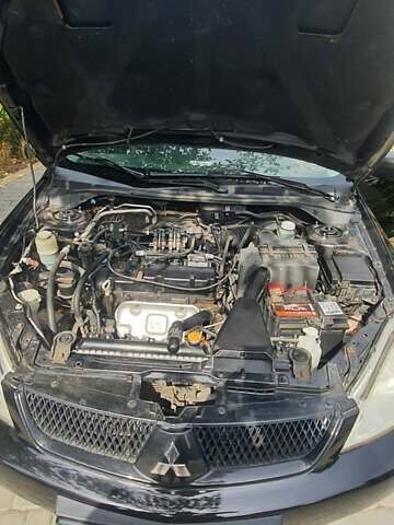 Мицубиси Лансер, объемом двигателя 1.58 л и пробегом 220 тыс. км за 4200 $, фото 9 на Automoto.ua