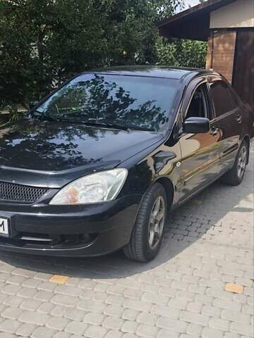 Мицубиси Лансер, объемом двигателя 1.58 л и пробегом 220 тыс. км за 4200 $, фото 2 на Automoto.ua