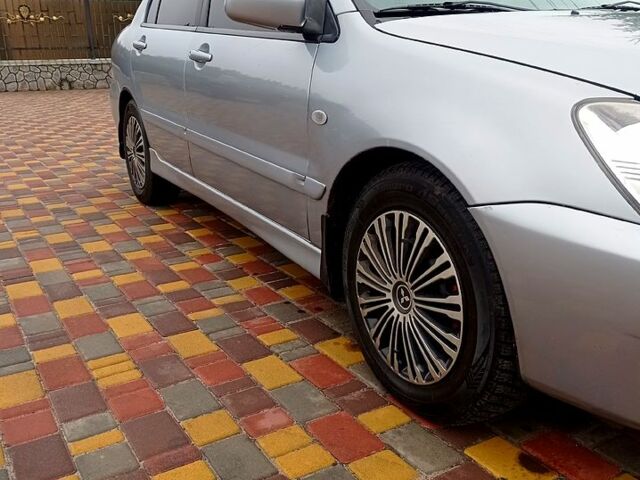 Мицубиси Лансер, объемом двигателя 1.6 л и пробегом 230 тыс. км за 3800 $, фото 6 на Automoto.ua