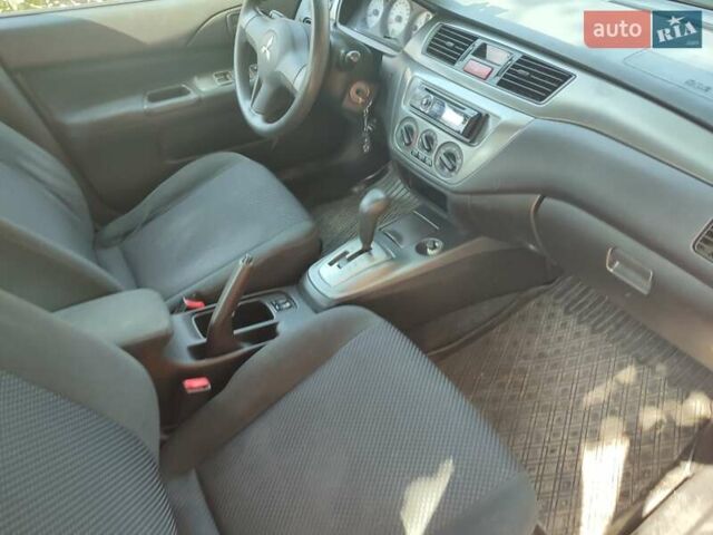Мицубиси Лансер, объемом двигателя 1.6 л и пробегом 140 тыс. км за 3600 $, фото 4 на Automoto.ua