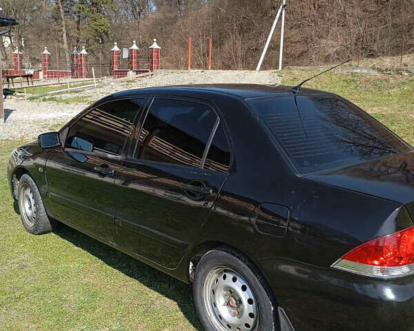 Мицубиси Лансер, объемом двигателя 1.6 л и пробегом 185 тыс. км за 5000 $, фото 5 на Automoto.ua
