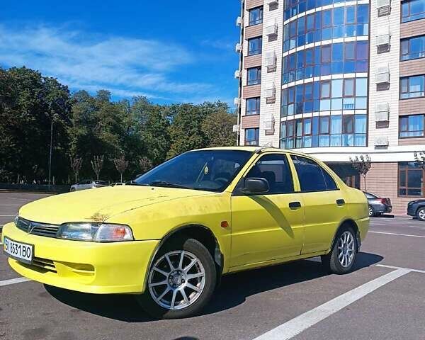 Жовтий Міцубісі Lancer, об'ємом двигуна 1.3 л та пробігом 306 тис. км за 1500 $, фото 2 на Automoto.ua