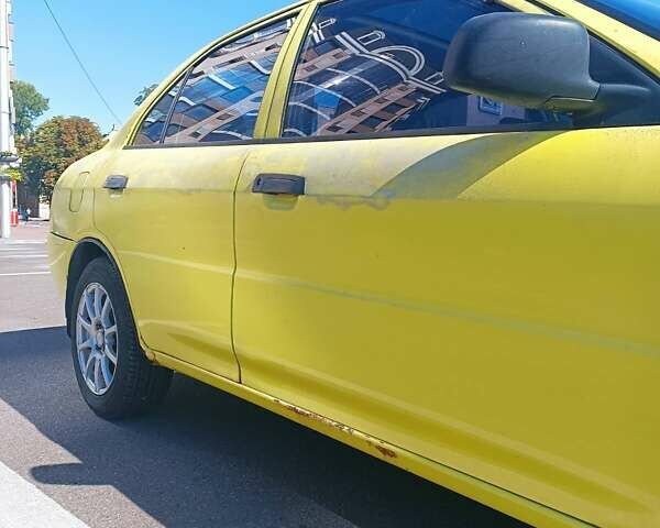 Жовтий Міцубісі Lancer, об'ємом двигуна 1.3 л та пробігом 306 тис. км за 1500 $, фото 5 на Automoto.ua