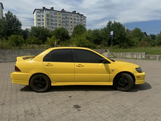 Жовтий Міцубісі Lancer, об'ємом двигуна 2 л та пробігом 262 тис. км за 3300 $, фото 3 на Automoto.ua