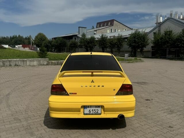 Жовтий Міцубісі Lancer, об'ємом двигуна 2 л та пробігом 262 тис. км за 3300 $, фото 2 на Automoto.ua