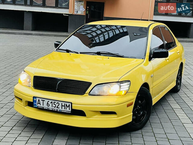 Желтый Мицубиси Лансер, объемом двигателя 2 л и пробегом 263 тыс. км за 4500 $, фото 28 на Automoto.ua