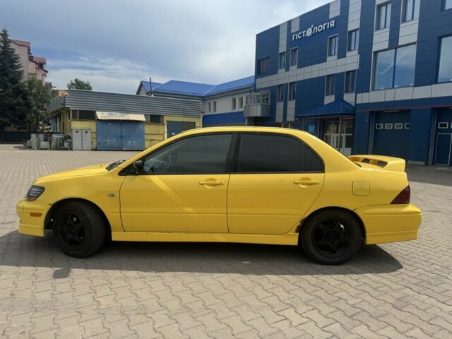 Жовтий Міцубісі Lancer, об'ємом двигуна 2 л та пробігом 262 тис. км за 3300 $, фото 1 на Automoto.ua