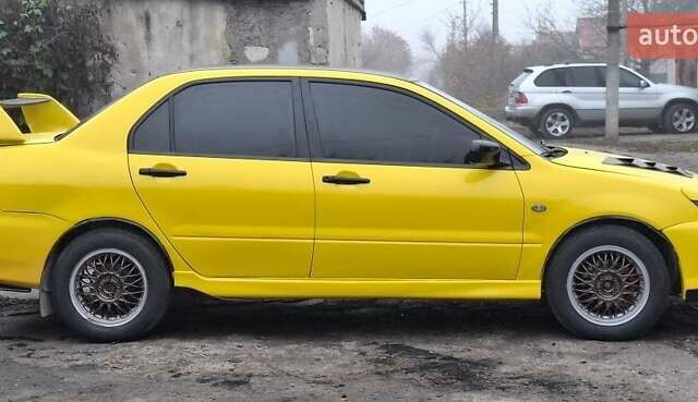 Желтый Мицубиси Лансер, объемом двигателя 1.3 л и пробегом 380 тыс. км за 3500 $, фото 13 на Automoto.ua
