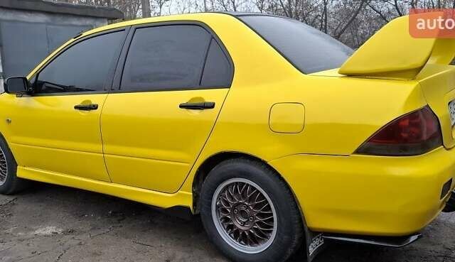Желтый Мицубиси Лансер, объемом двигателя 1.3 л и пробегом 380 тыс. км за 3500 $, фото 17 на Automoto.ua