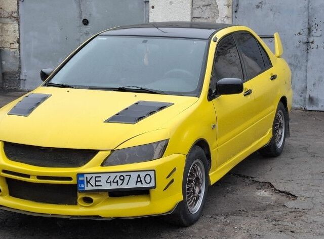Жовтий Міцубісі Lancer, об'ємом двигуна 1.3 л та пробігом 380 тис. км за 3500 $, фото 9 на Automoto.ua