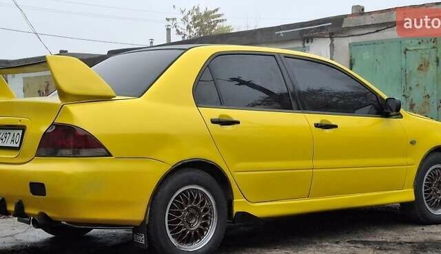 Желтый Мицубиси Лансер, объемом двигателя 1.3 л и пробегом 380 тыс. км за 3500 $, фото 20 на Automoto.ua