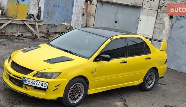 Желтый Мицубиси Лансер, объемом двигателя 1.3 л и пробегом 380 тыс. км за 3500 $, фото 11 на Automoto.ua