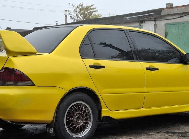 Жовтий Міцубісі Lancer, об'ємом двигуна 1.3 л та пробігом 380 тис. км за 3500 $, фото 21 на Automoto.ua