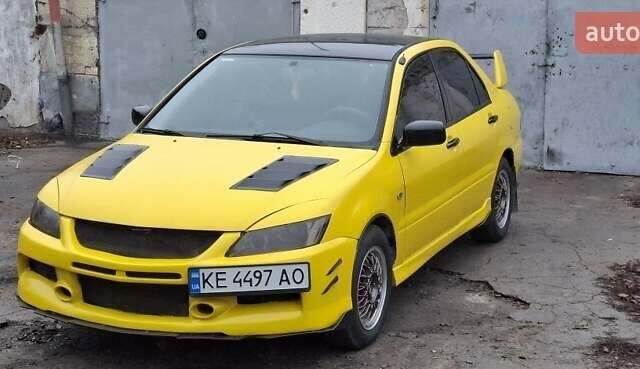 Желтый Мицубиси Лансер, объемом двигателя 1.3 л и пробегом 380 тыс. км за 3500 $, фото 8 на Automoto.ua