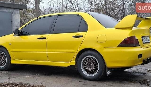 Желтый Мицубиси Лансер, объемом двигателя 1.3 л и пробегом 380 тыс. км за 3500 $, фото 19 на Automoto.ua