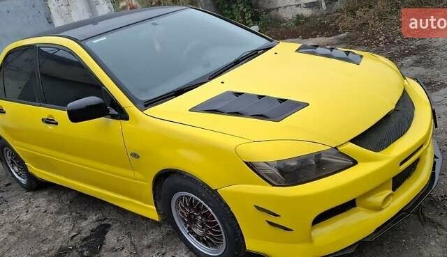 Желтый Мицубиси Лансер, объемом двигателя 1.3 л и пробегом 380 тыс. км за 3500 $, фото 21 на Automoto.ua