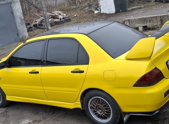 Жовтий Міцубісі Lancer, об'ємом двигуна 1.3 л та пробігом 380 тис. км за 3500 $, фото 13 на Automoto.ua