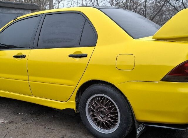 Жовтий Міцубісі Lancer, об'ємом двигуна 1.3 л та пробігом 380 тис. км за 3500 $, фото 18 на Automoto.ua