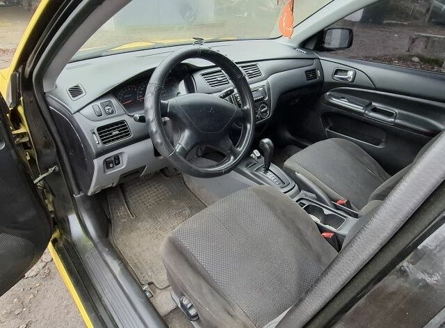 Жовтий Міцубісі Lancer, об'ємом двигуна 1.3 л та пробігом 380 тис. км за 3500 $, фото 10 на Automoto.ua