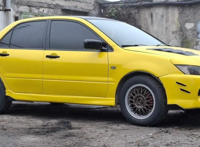 Жовтий Міцубісі Lancer, об'ємом двигуна 1.3 л та пробігом 380 тис. км за 3500 $, фото 15 на Automoto.ua
