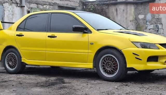 Желтый Мицубиси Лансер, объемом двигателя 1.3 л и пробегом 380 тыс. км за 3500 $, фото 14 на Automoto.ua
