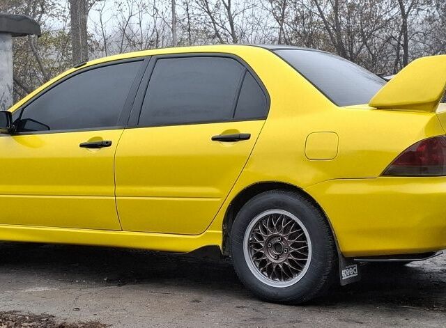 Жовтий Міцубісі Lancer, об'ємом двигуна 1.3 л та пробігом 380 тис. км за 3500 $, фото 20 на Automoto.ua