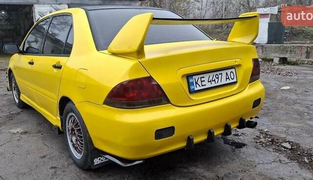 Желтый Мицубиси Лансер, объемом двигателя 1.3 л и пробегом 380 тыс. км за 3500 $, фото 18 на Automoto.ua
